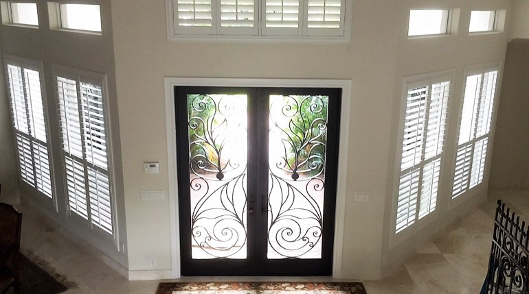 New Brunswick foyer with glass doors and interior shutters